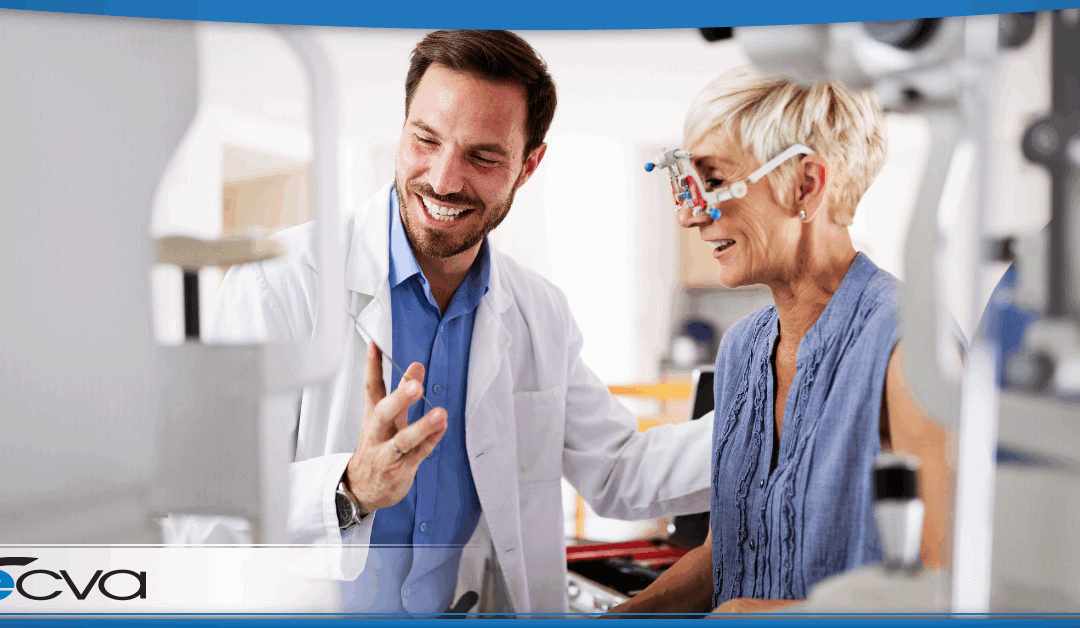 Eye doctor talking to older patient